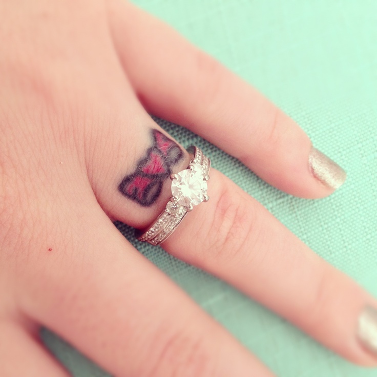 Small Bow Heart Tattoo On Finger For Girls