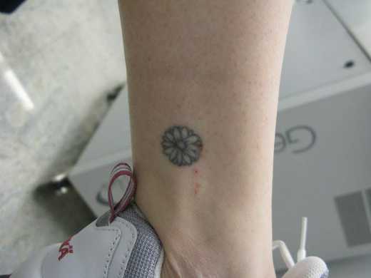 Small Daisy Flower Tattoo On Ankle