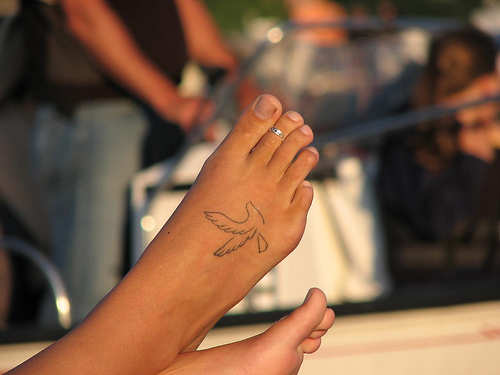 Small Dove Outline Tattoo On Foot