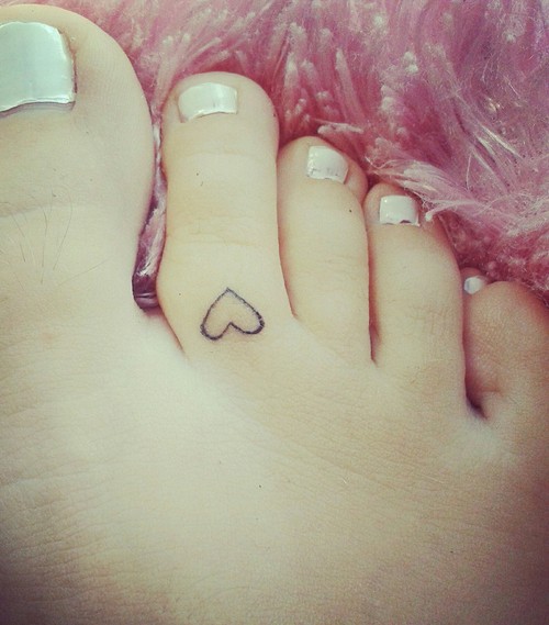 Small Heart Outline Tattoo On Toe