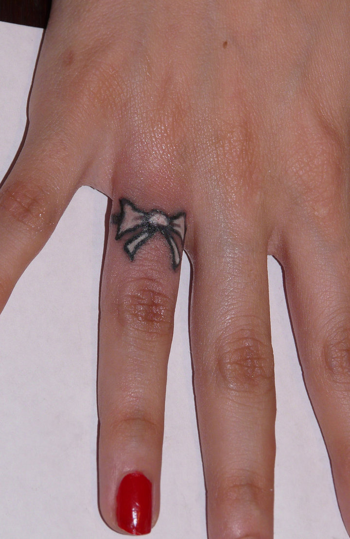 Small Pink Bow Tattoo On Finger For Girls