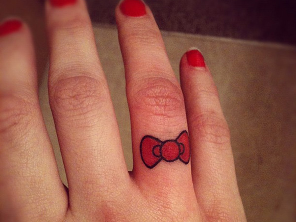 Small Red Bow Tattoo On Finger For Girls