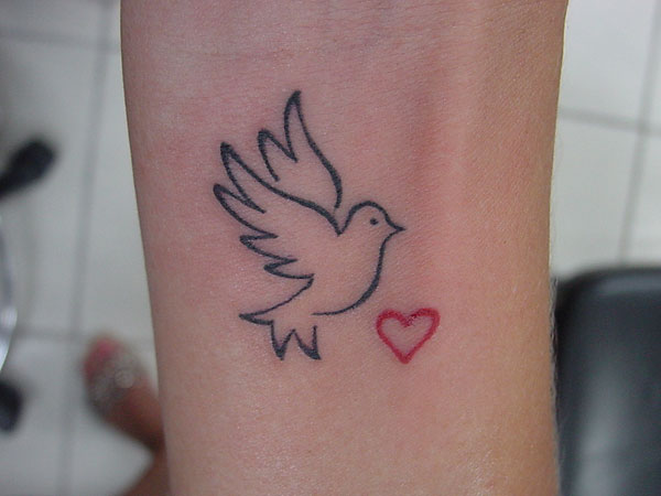 Small Red Heart And Outline Dove Tattoo On Wrist