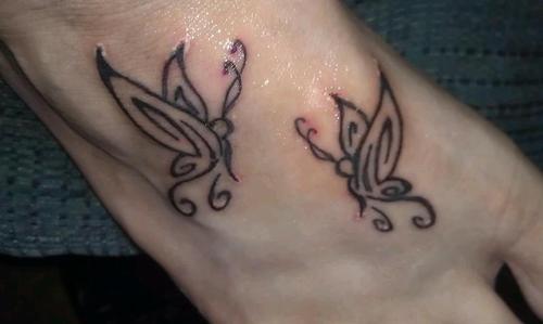 Small Tribal Butterflies Tattoo On Foot