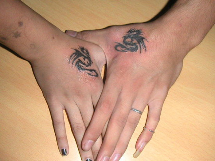 Small Tribal Dragon Matching Tattoos On Side Hands For Couples