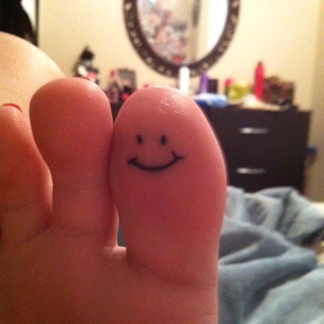 Smiley Bottom Of Toe Tattoo