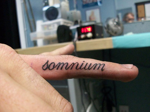 Somnium Word Tattoo On Finger