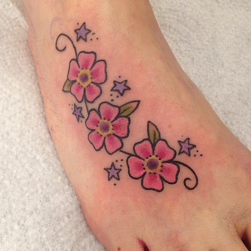 Stars And Daisy Foot Tattoo