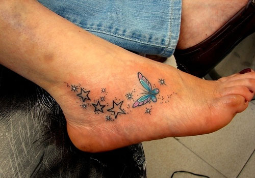 Stars With Colorful Butterfly Tattoo On Foot