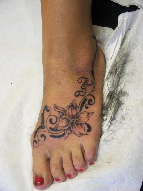 Stylish Black And White Flower Tattoo On Foot For Women