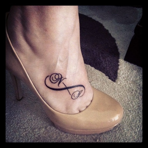 Stylish Letters Infinity Tattoo On Foot