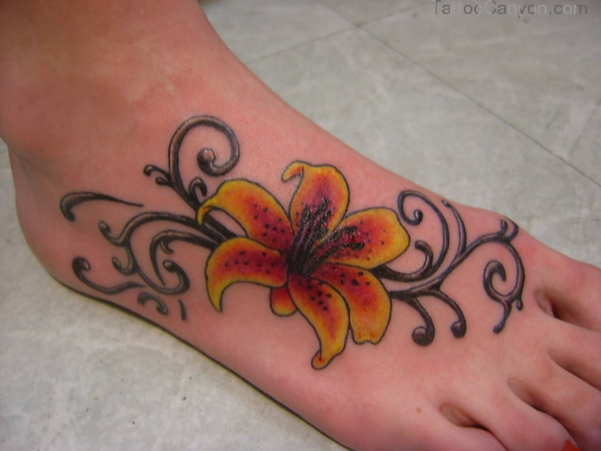 Stylish Lily Flower Tattoo On foot