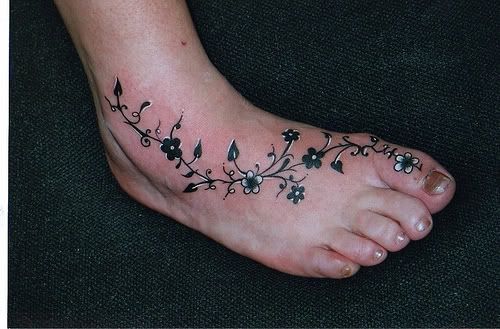 Stylish Small Flowers Black And White Tattoo On Foot