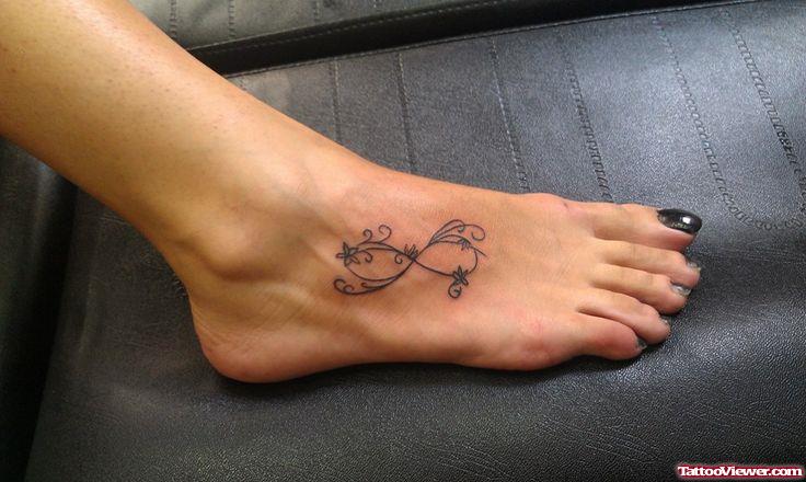 Stylish Star Infinity Tattoo On Girl Foot
