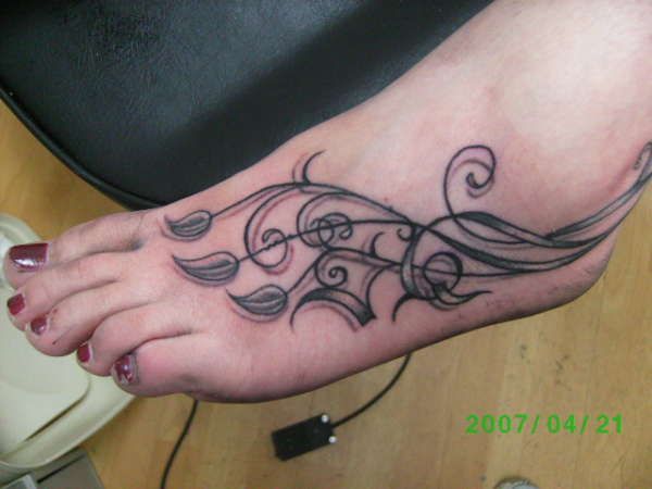 Stylish Vine Tattoo On Foot For Girls