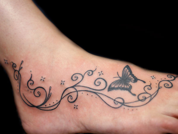 Swirly Butterfly And Stars Tattoo On Foot