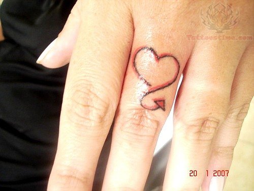 Tail Heart Tattoo On Girl Finger