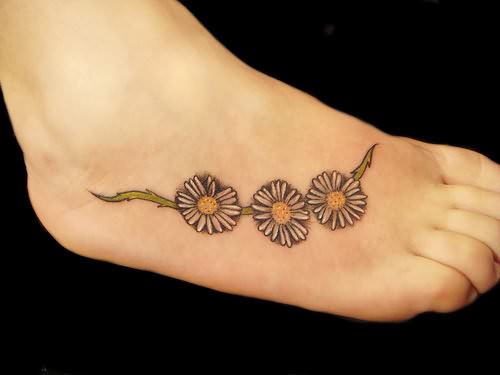 Three Daisy Flowers Tattoos On Right Foot