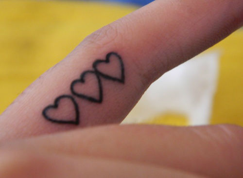 Three Heart Tattoos On Side Finger