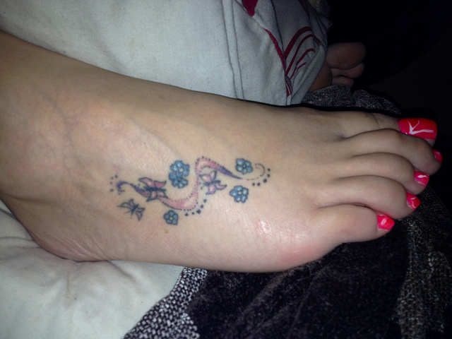 Tiny Butterflies With Flowers Tattoo On Foot For Girls