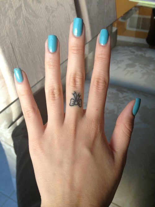 Tiny Colorless Finger Bow Tattoo For Girls