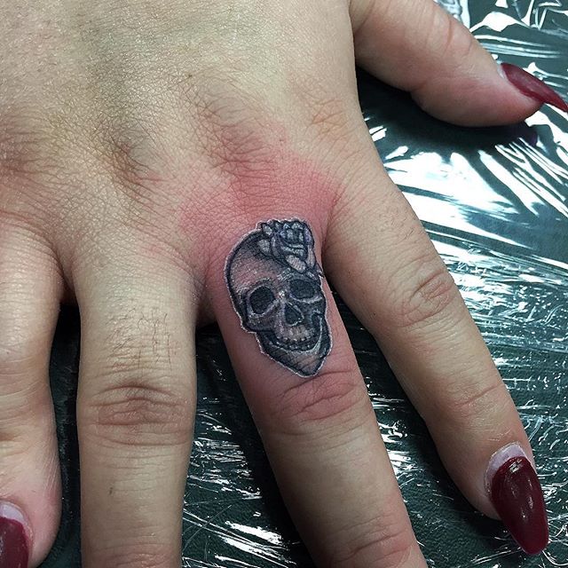 Tiny Floral Skull Tattoo On Girl Finger