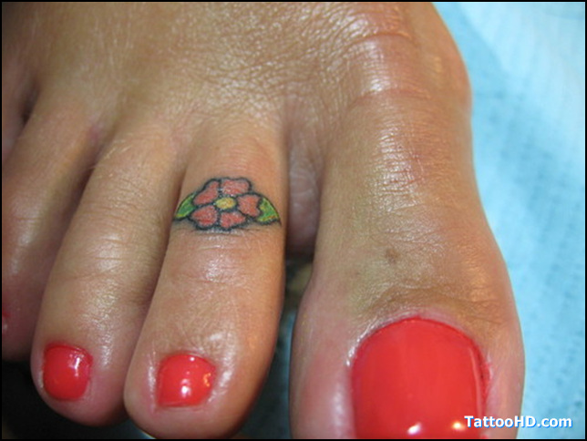 Tiny Hibiscus Flower Tattoo On Toe