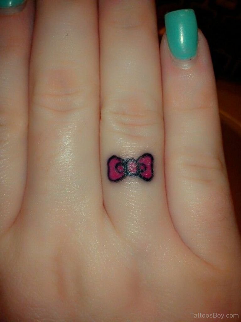 Tiny Red Bow Tattoo On Finger For Girls