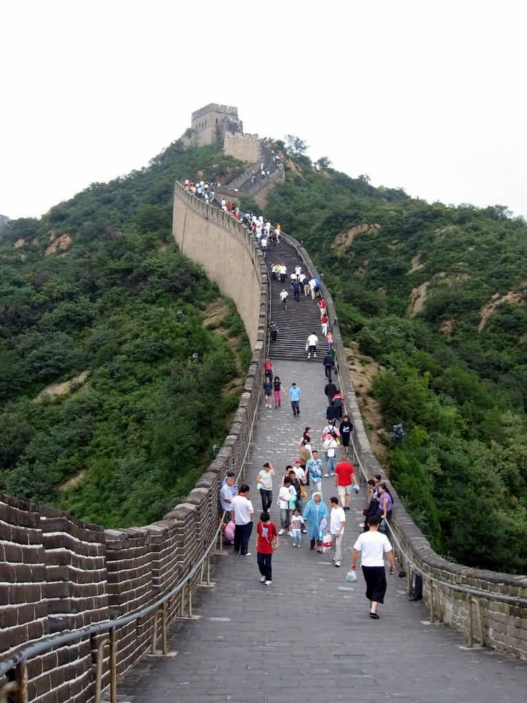 Tourists Walking On The Great Wall Of China