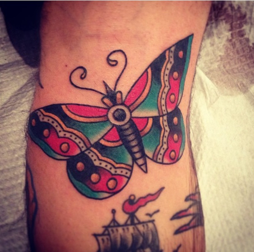 Traditional Butterfly With Sea Ship Tattoo