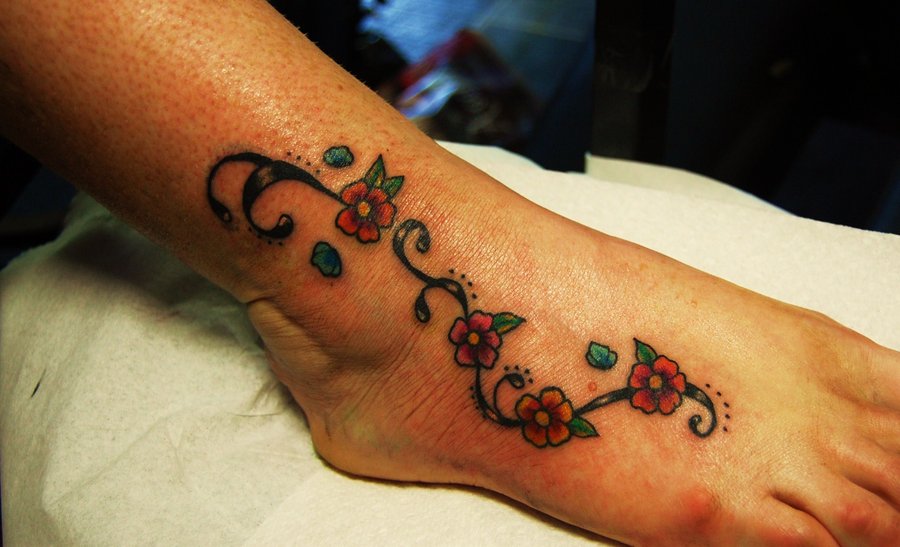 Traditional Red Flowers Tattoo On Foot