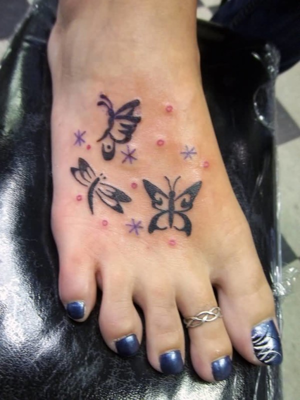 Tribal Black Butterflies And Dragonfly Stars Tattoo On Foot
