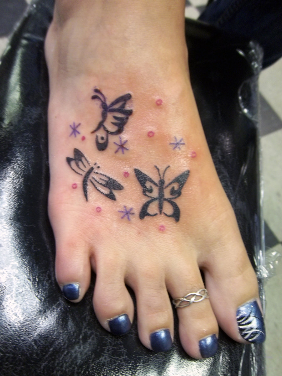 Tribal Stars Butterflies Tattoo On Foot For Girls
