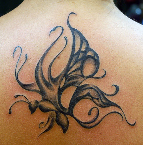 Unique Grey Tribal Butterfly Tattoo On Upper Back