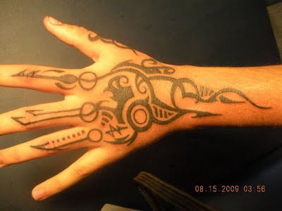 Unique Tribal Tattoo On Left Hand