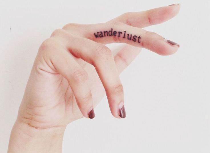 Wander Lust Words On Girly Finger Tattoo