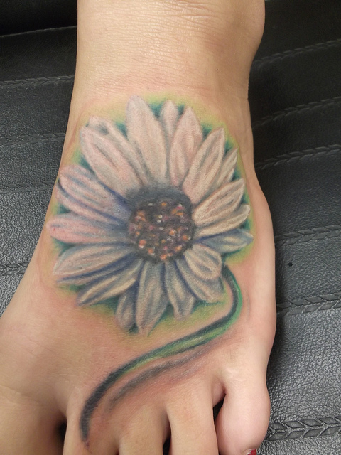 White Daisy Flower Tattoo On Girl Left Foot