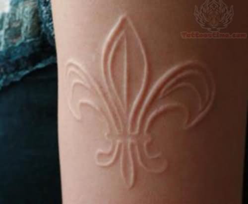 White Ink Fleur De Lis Scarification Tattoo