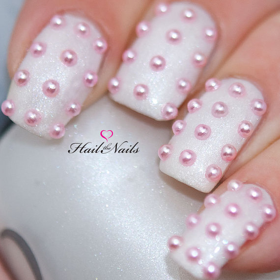 White Nails With Pink Pearl Studs Nail Art