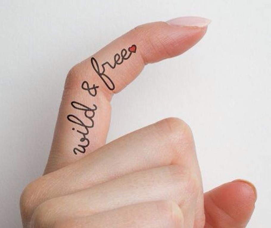 Wild And Free Inner Finger Words Tattoo For Girls