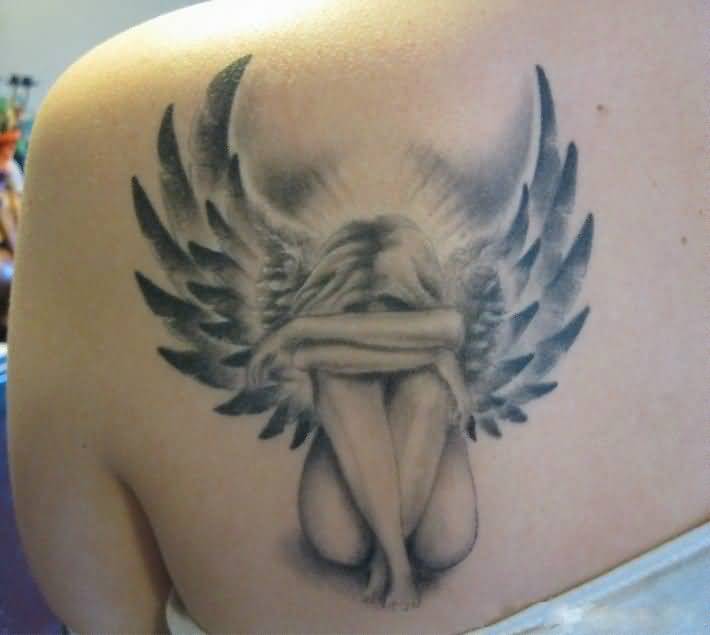 Wonderful Alone Angel Tattoo On Upper Back For Women