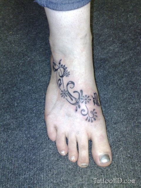 Wonderful Floral Butterfly Vine Tattoo On Girl Foot