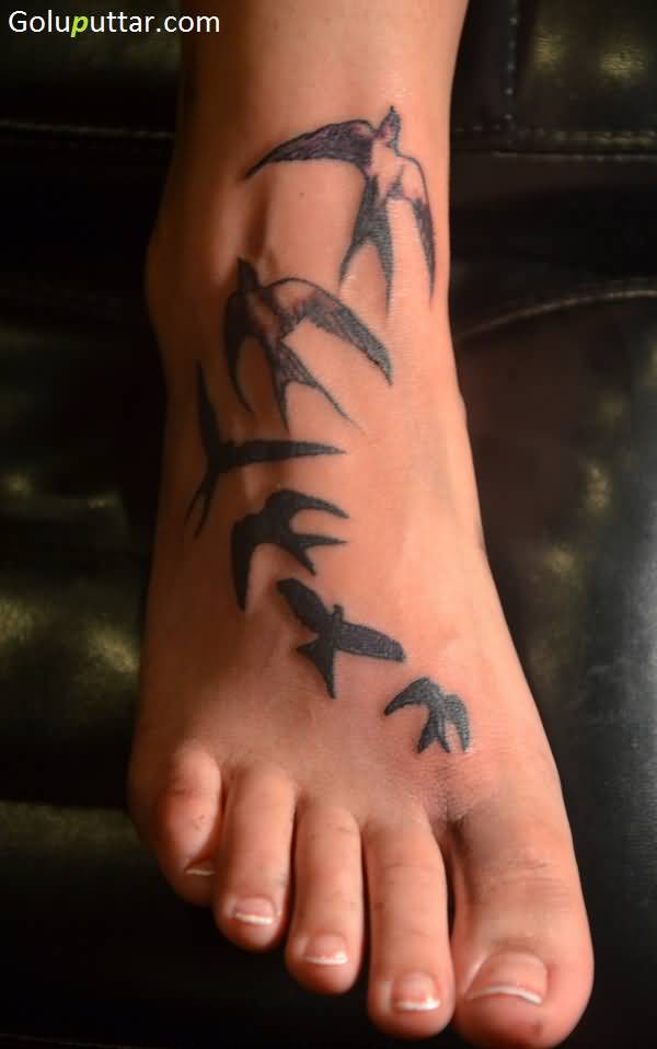 Wonderful Flying Swallow Birds Tattoo On Foot