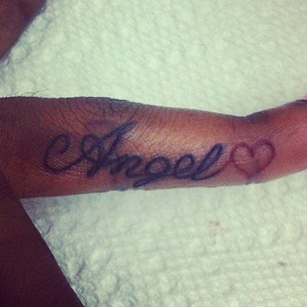 Word Angel And Heart Tattoo On Finger