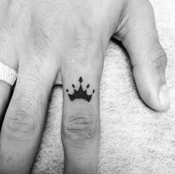 Amazing Black Crown Tattoo On Girl Finger