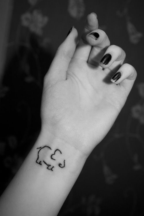 Amazing Black Outline Elephant Tattoo On Girl Left Wrist