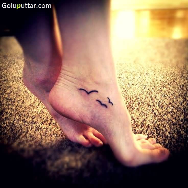 Amazing Flying Birds Tattoos On Girl Ankle