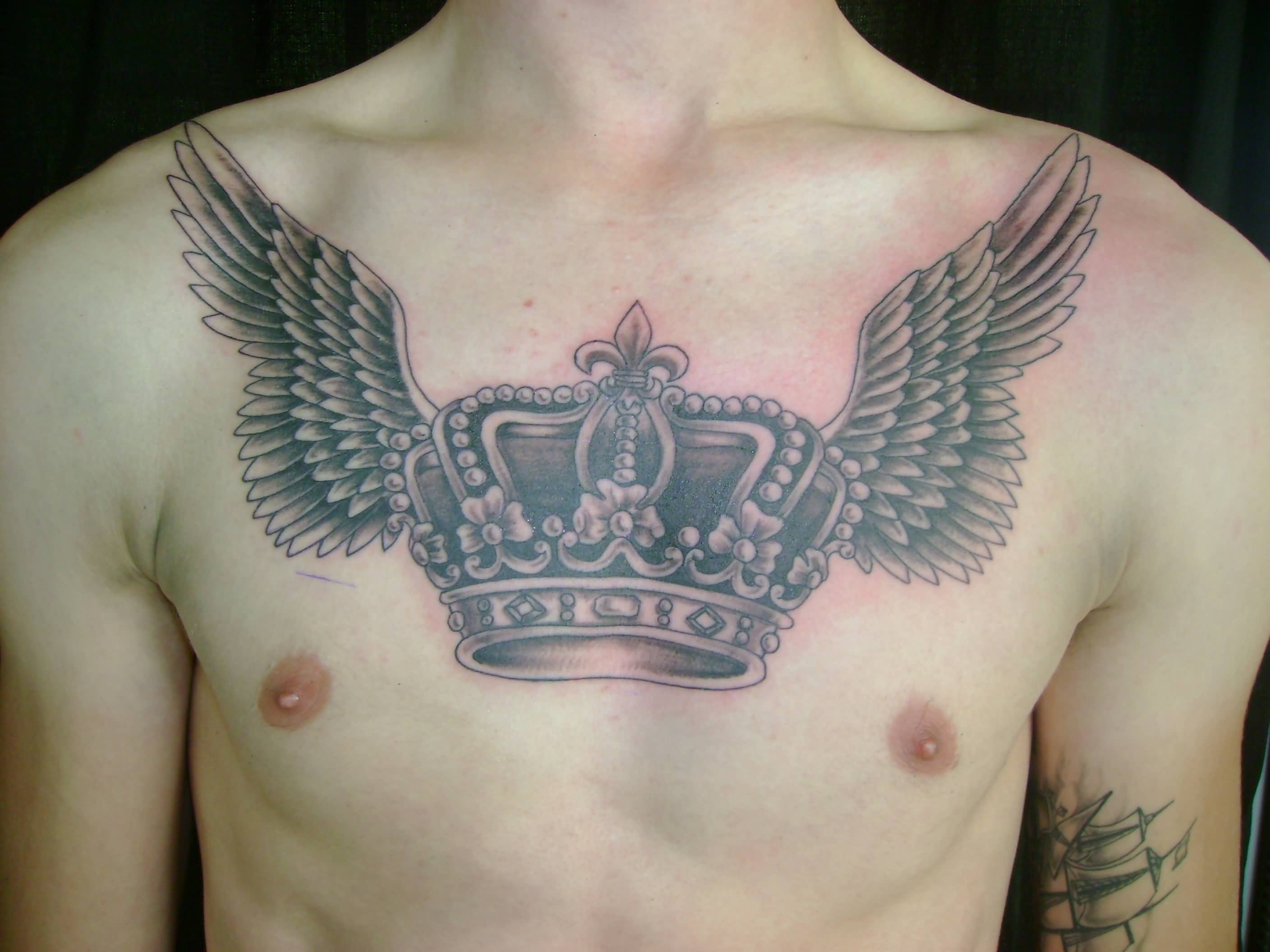 Angel Winged Crown Tattoo On Man Chest
