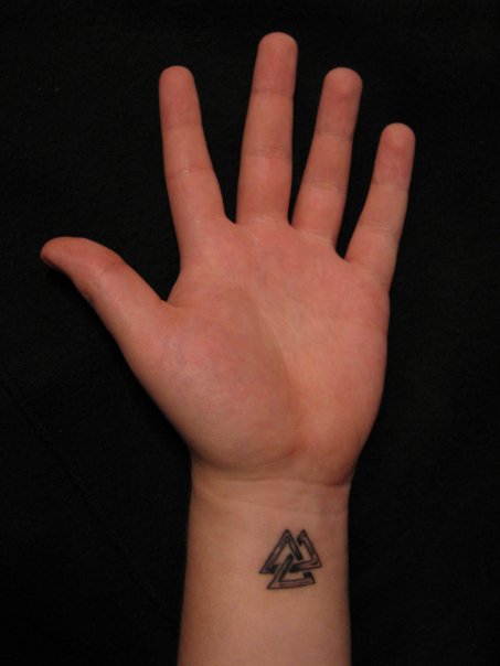 Attractive Black Ink Triangle Tattoo On Left Wrist