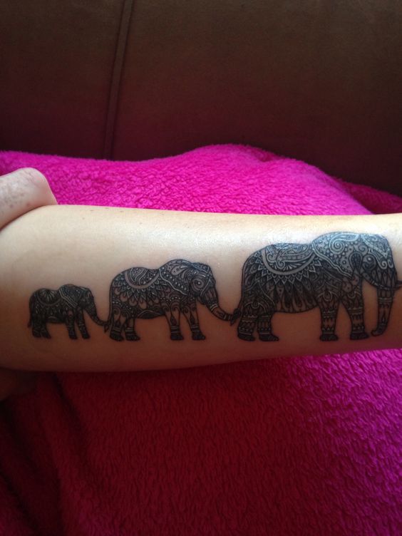 Attractive Elephant Family Tattoo On Arm